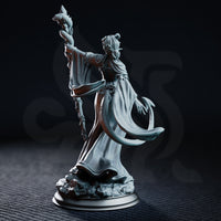 Violet Moonridge Tiefling Lunar Priestess by DM Stash — three-quarter view showing wide ceremonial sleeves, fitted bodice with botanical relief, serpent-entwined staff raised high, shattered stone base.