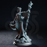Tiefling Lunar Priestess Violet Moonridge by DM Stash — robed figure with small horns and a curling tail, raising a tall serpent-wrapped staff, floral bodice detail, rubble scenic base.