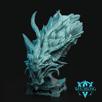 Digital render of the Warden of the Damned bust by Witchsong Miniatures — an unpainted teal resin draconic bust featuring swept-back feathers, curving horns, an open snarling jaw with hooked fangs, and a decorative stone plinth base, shown against a black background