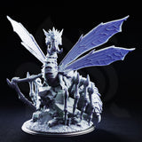 Xaniri the Dragonspider of Irinax by DM Stash — winged arachnid creature with a crested draconic head, four veined wings spread wide, long barbed legs planted on shattered rock rubble. Grey resin render.
