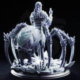 Blindfolded drow drider priestess with braided hair, one arm raised, robes draped over a barbed giant spider with eight splayed legs curving outward over a rubble-strewn cavern base. Sculpt by DM Stash.