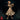Young female mage with curly hair, round spectacles, and a beaded headband, extending both hands forward in a spellcasting pose. Geometric latticed robes with structured shoulder pauldrons. Sculpt by Monster Atlas.