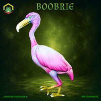 Boobrie miniature by The Toadstool Weaver — a tall wading bird with pink and lilac plumage, hooked yellow-green beak, and a single teal eye, standing upright with layered feather detail across the body and wings.
