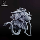 Leaf-cloaked jerboa creature clutching a gnarled wooden staff, covered in fur and bark-like skin with wide soulful eyes, large overlapping leaf wings fanned out across its back. Sculpt by La Louve 3D.