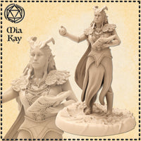 Unpainted resin miniature of a female demonic warlock at 32mm scale — digital render showing a horned elven figure in ornate robes with leaf-like pauldrons, cradling a spellbook in one arm and holding a glowing arcane orb in her outstretched hand, posed mid-stride on a rocky scenic base. Artist logo for Mia Kay M3DM visible in corner.