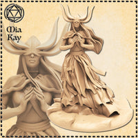 Digital render of the Duchess of Death miniature by Mia Kay M3DM — a blindfolded female fiend with tall branching antler horns, hands pressed together at her chest, wearing layered flowing robes, shown from two angles including a close-up of her face and upper body, unpainted in sandy resin tone on a textured oval base, 32mm scale