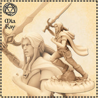 Unpainted resin miniature of an elven fallen paladin in a charging pose, wielding a large crescent-pommelled greatsword raised overhead, long hair swept back, wearing a travelling cloak and light armour, mounted on a cracked stone scenic base — 32mm scale by Mia Kay M3DM