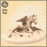 Digital render of a baby pegasus miniature at 32mm scale — an unprimed foal in a resting pose, tucked on a sculpted cloud base with wings half-raised, detailed feathering, and wide expressive eyes, by Mia Kay M3DM