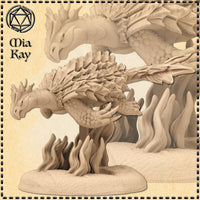 Digital render of a Dragon Turtle miniature by Mia Kay M3DM, shown in an unpainted sandy beige resin tone. The creature is coiled in a compact pose with layered dorsal scale ridges, swept-back horns, and a broad reptilian head angled downward. It is mounted on a swirling flame-effect base. A close-up detail of the head and upper scales is shown in the background.