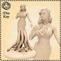 Unpainted resin render of the Cecaelia miniature by Mia Kay M3DM, showing a half-elven female figure with octopus tentacles in place of legs, one hand raised to her chest, standing on a detailed coastal base with starfish and shells, alongside a close-up of her face showing pointed ears and a cool, calculating expression