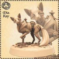 Digital render of the Clockwork Fox miniature by Mia Kay M3DM — an unpainted mechanical fox construct in a prowling pose with gear-jointed limbs, segmented armour plating, and a swept tail, mounted on a gear-textured round base at 32mm scale