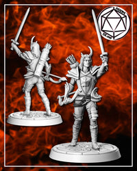Two unpainted grey resin views of the Demonic Paladin miniature — front view shows the warrior with sword held aloft, horns curling above pointed ears, chest crest and buckled greaves clearly visible; rear view reveals the quiver, back armour detail, and flowing hair. Both figures stand on cobblestone round bases against a dramatic flame background.