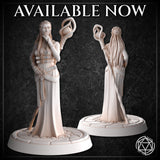 Unpainted white resin render of the Female Sorceress miniature by Mia Kay M3DM shown from front and back — braided hair pinned at the back, ornate cameo brooch on the bodice, floral belt detail, and a swirling arcane ring focus raised aloft, mounted on a textured cobblestone round base