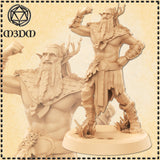 Digital render of an unpainted Firbolg Barbarian miniature at 32mm scale, shown from two angles — full figure with raised fist, leaf-wrapped kilt, stag antlers, and braided beard, plus a close-up bust of the face and woven bark mantle. Sculpted by Mia Kay M3DM.