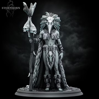 Orc shaman standing tall, holding a gnarled skull-topped staff, wearing a bird-skull headdress with sweeping feathers and a fur wrap with an animal skull at the waist. Sculpt by Stormborn Collectibles.
